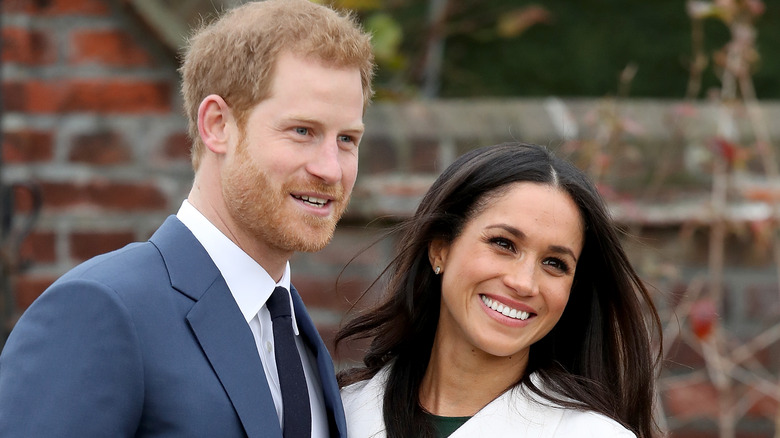 Prince Harry and Meghan Markle posing