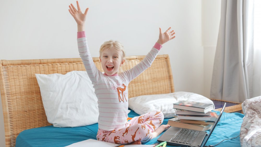 Girl in pajamas on laptop