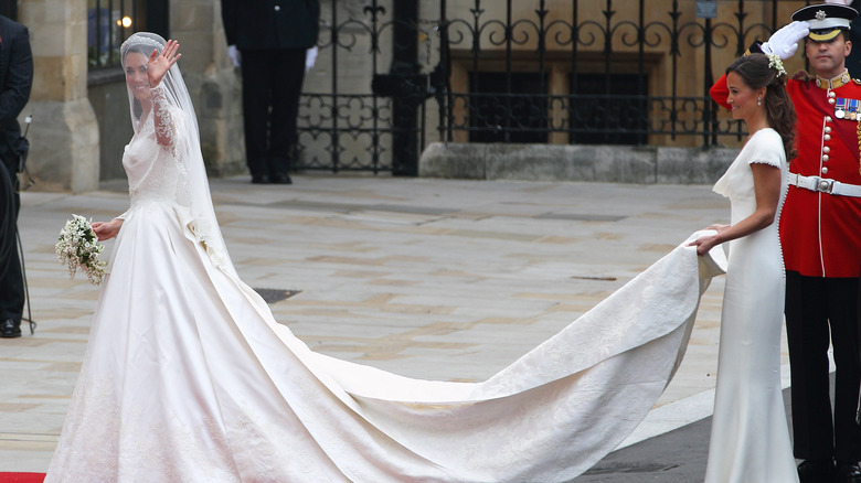 Pippa Middleton holding the train of sister Kate's wedding gown