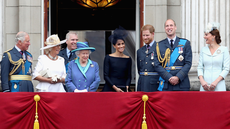 royal family smiling at Buckingham Palace