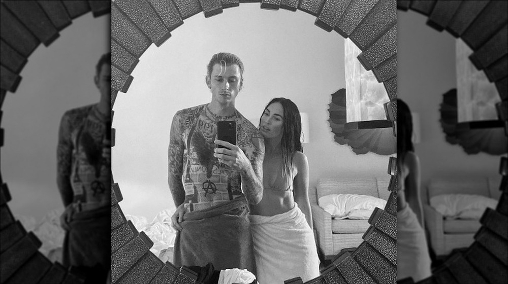 Megan Fox and MGK wearing towels