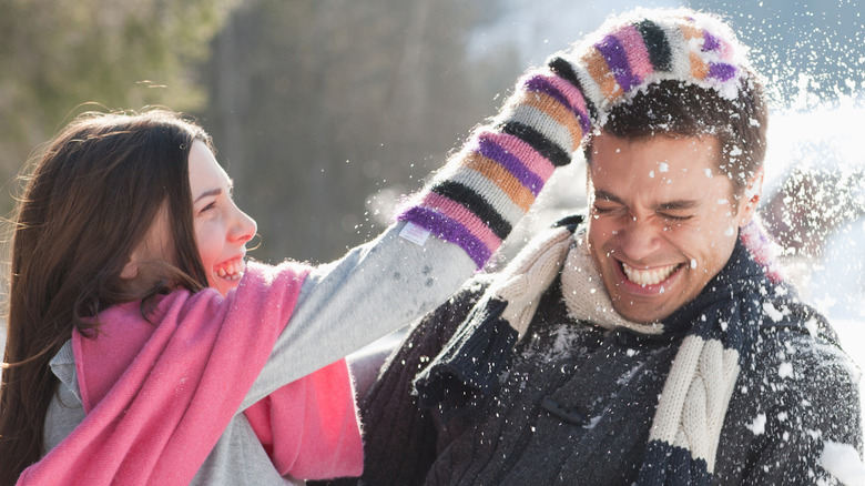 Couple playing in the snow