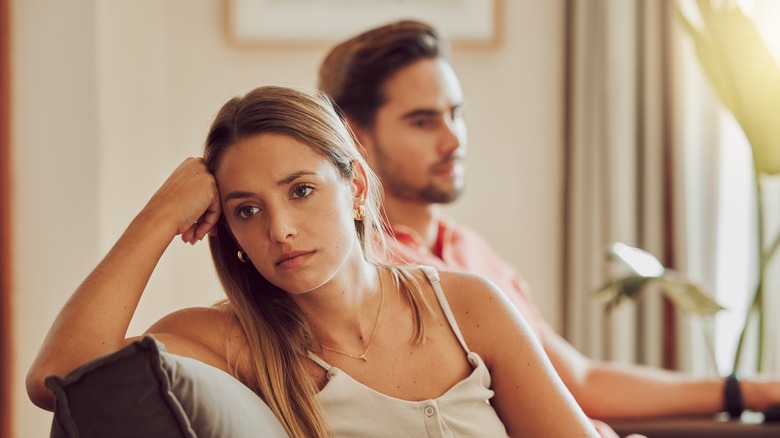 A couple looking frustrated with each other