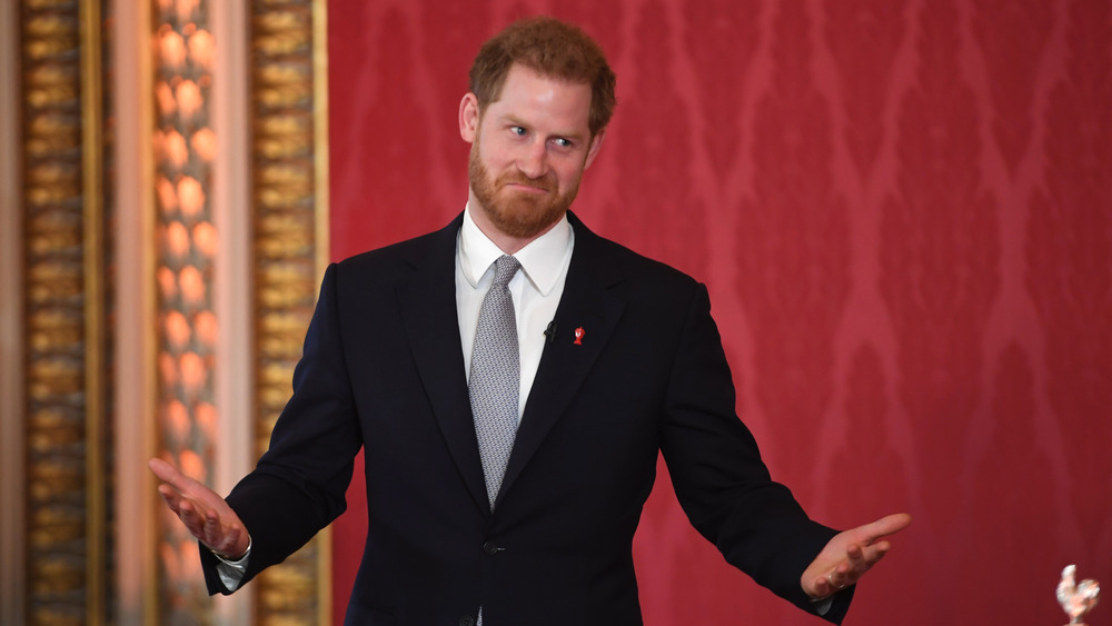 Prince Harry making gesturing