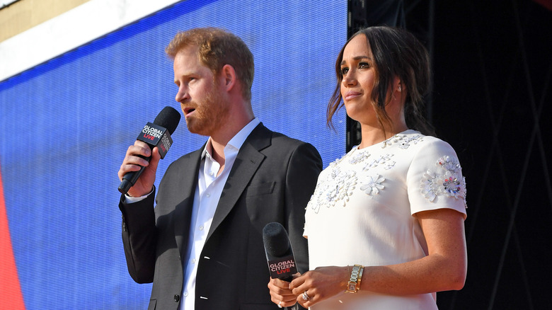 Prince Harry speaks alongside Meghan Markle