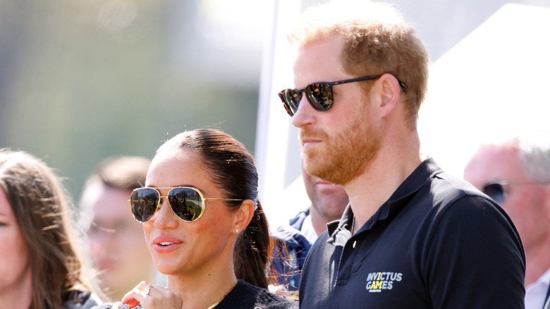 Meghan Markle and Prince Harry watching an event