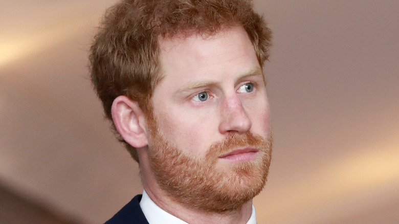 Prince Harry looking pensive in a suit