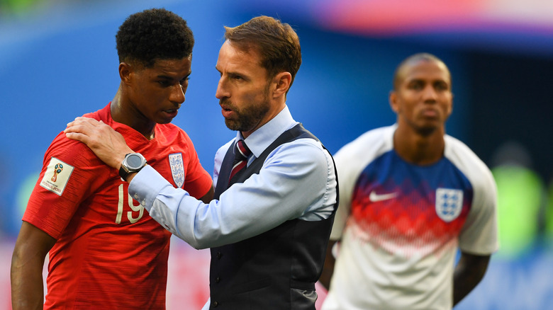 Gareth Southgate and Marcus Rashford during a soccer match