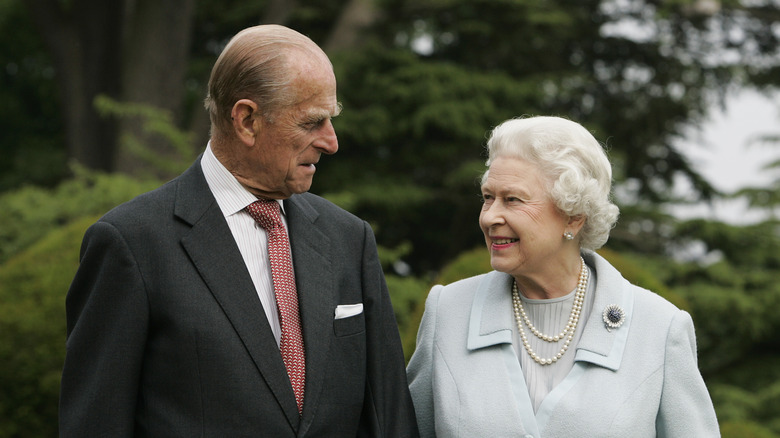 Queen Elizabeth II and Prince Philip pose for a photo