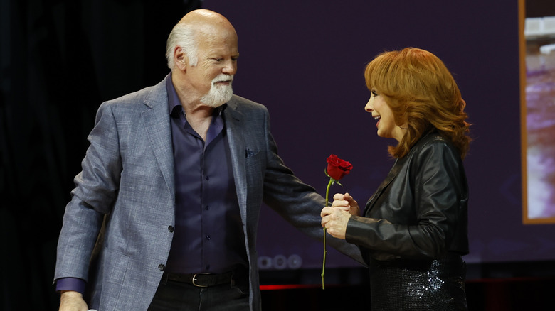 Linn Rex and McEntire at an event on stage