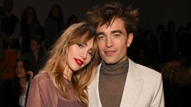 Suki Waterhouse rests head on Robert Pattinson's shoulder