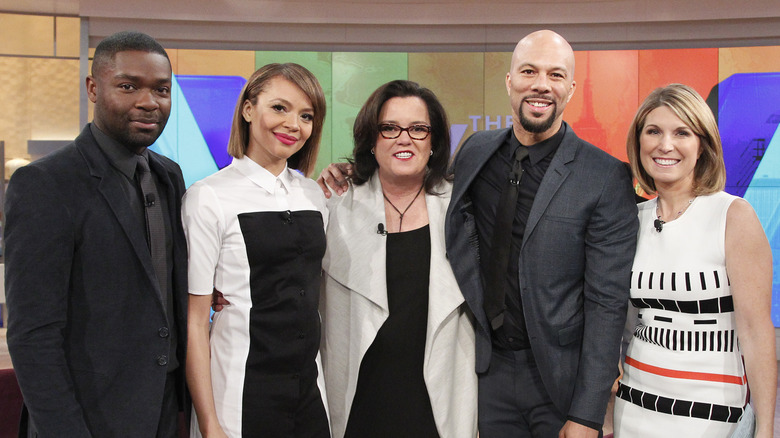 rosie odonnell posing with guests on the view