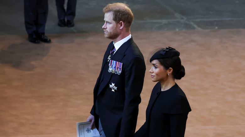 Prince Harry and Meghan Markle walking at Westminster Hall 