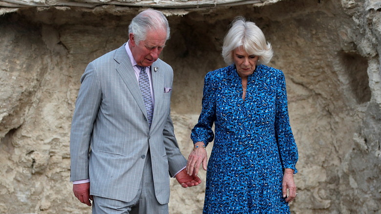 Charles and Camilla about to hold hands