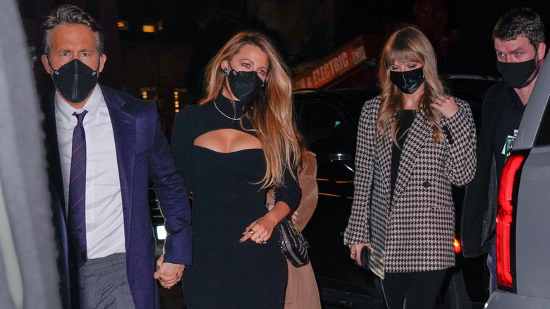 Ryan Reynolds, Blake Lively, and Taylor Swift wearing masks