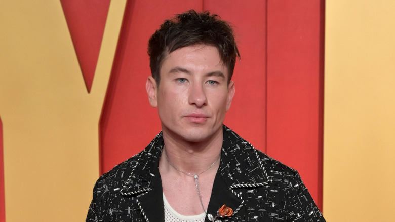 Barry Keoghan posing on red carpet in a black jacket