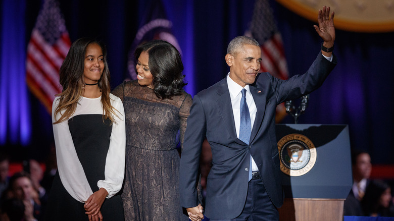 Barack Obama waves next to Malia and Michelle Obama 