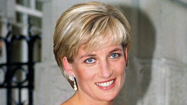 Princess Diana smiles for photographers