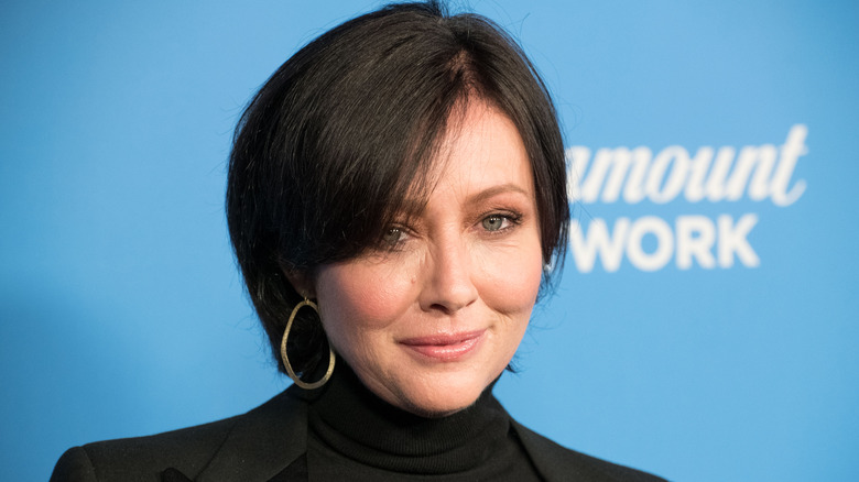 Shannen Doherty smiles for a photo.