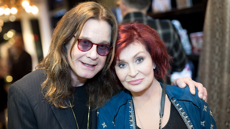 Ozzy Osbourne and Sharon Osbourne posing for photos