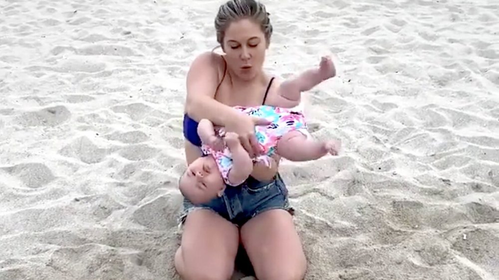 Shawn Johnson and baby on beach