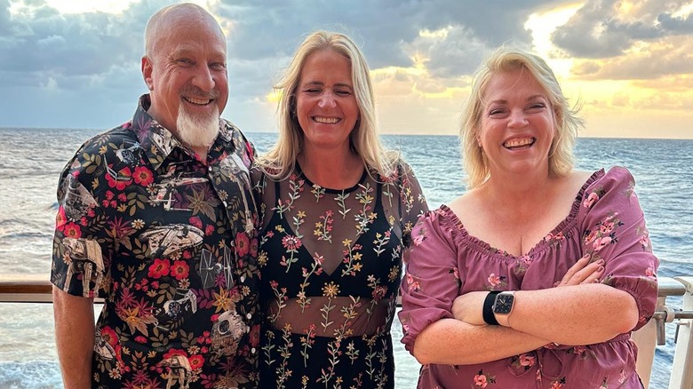 David Woolley smiling with Christine and Janelle Brown