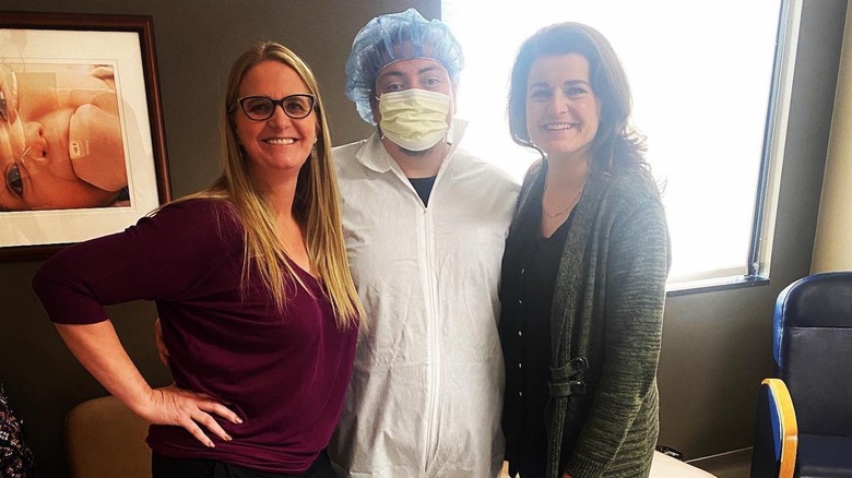 Christine Brown, Tony Padron, and Robyn Brown smiling