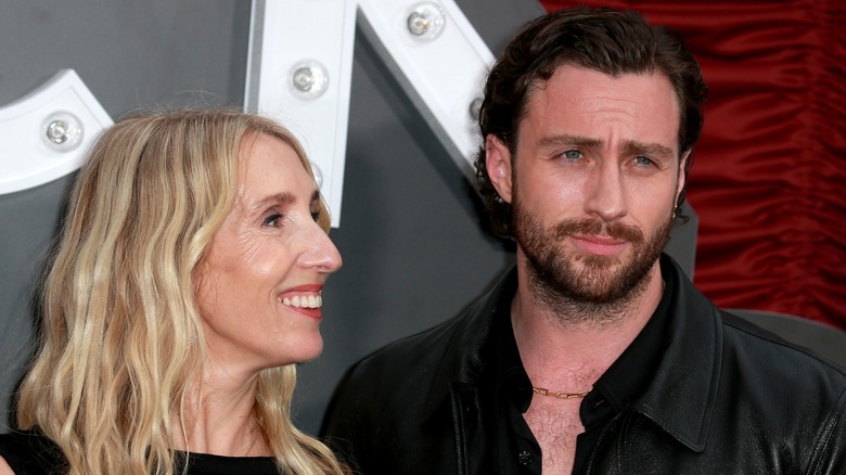 Sam Taylor-Johnson smiling at Aaron Taylor-Johnson.