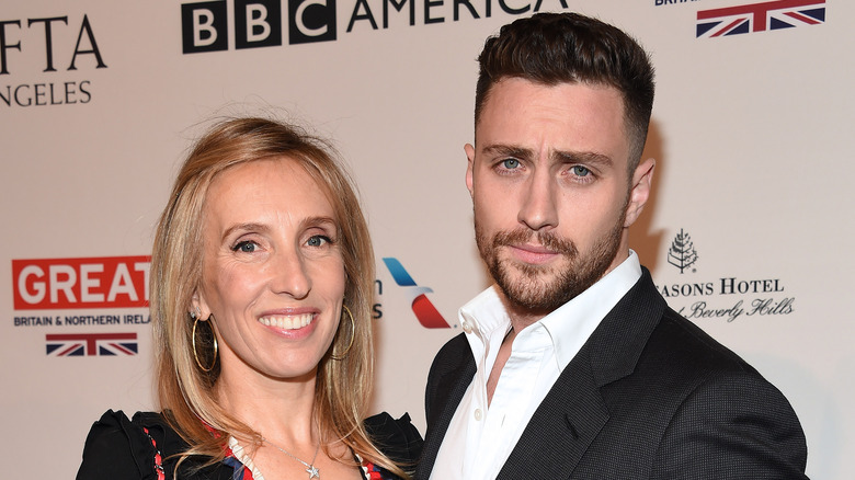 Sam Taylor-Johnson smiling next to Aaron Taylor-Johnson.