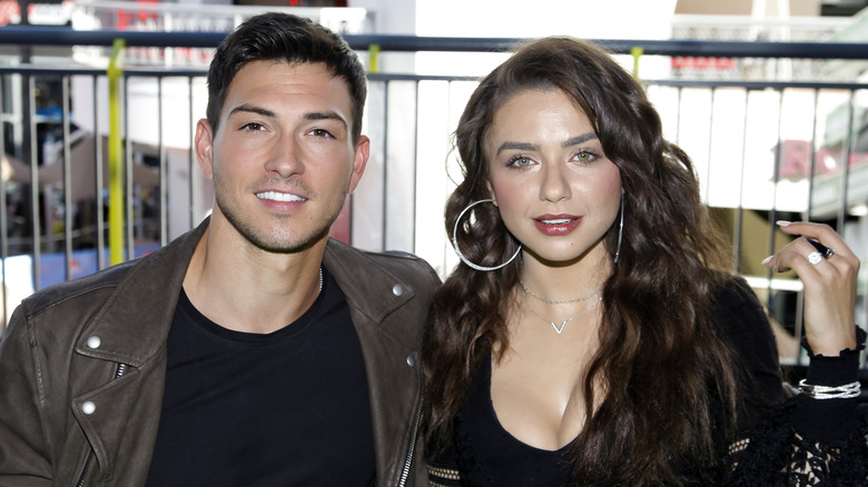 DOOL stars Robert Scott Wilson and Victoria Konefal pose for a photo. 