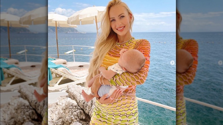 Christine Quinn holding baby at the beach 