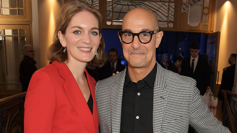 Stanley Tucci and Felicity Blunt smiling