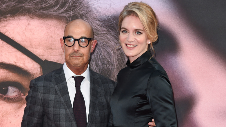 Stanley Tucci and Felicity Blunt posing for photos