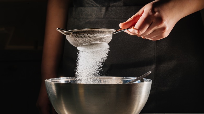 Sifting powdered sugar 