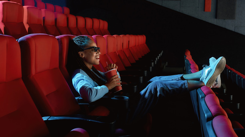 Woman sitting alone in movies 