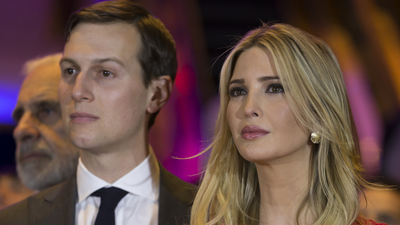 Jared Kushner and Ivanka Trump with serious expressions at an event