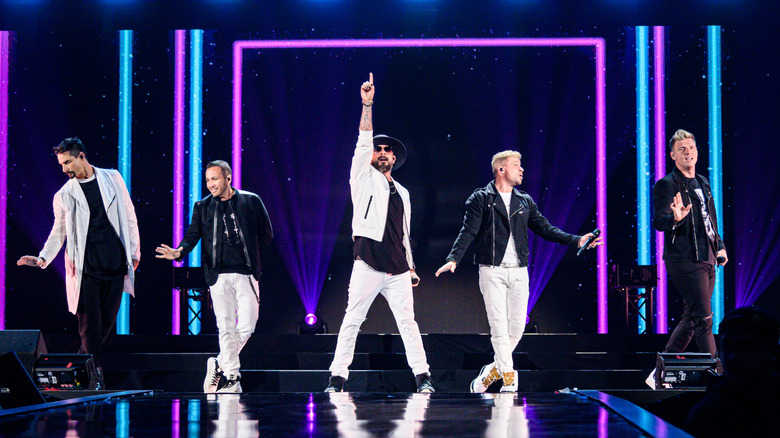 The Backstreet Boys posing on stage