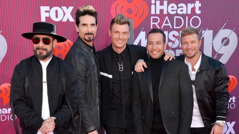 The Backstreet Boys smiling on the red carpet