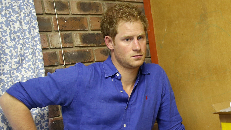 Prince Harry leaning