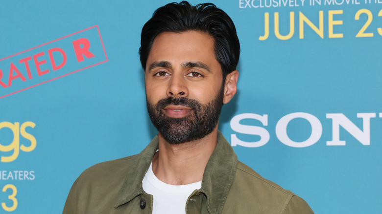 Hasan Minhaj posing at event