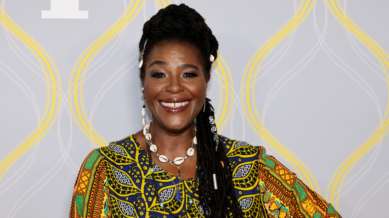 Sharon D. Clarke smiling on step-and-repeat