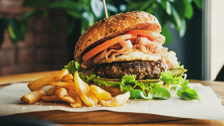 A cheeseburger with fries