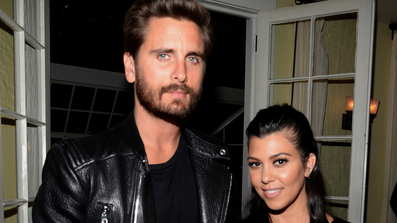 Scott Disick and Kourtney Kardashian at an event.