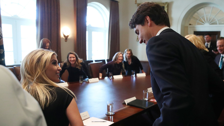  Justin Trudeau helps Ivanka Trump with her chair 