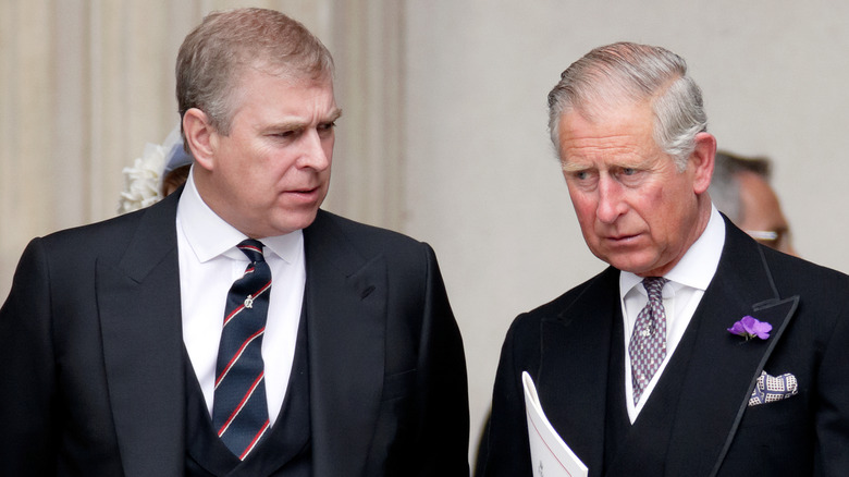 King Charles looks angry next to Prince Andrew