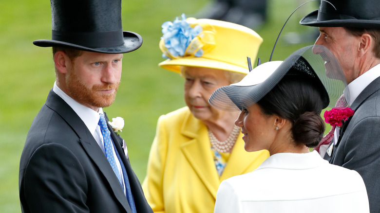 Prince Harry, Meghan Markle and Queen Elizabeth at royal event.