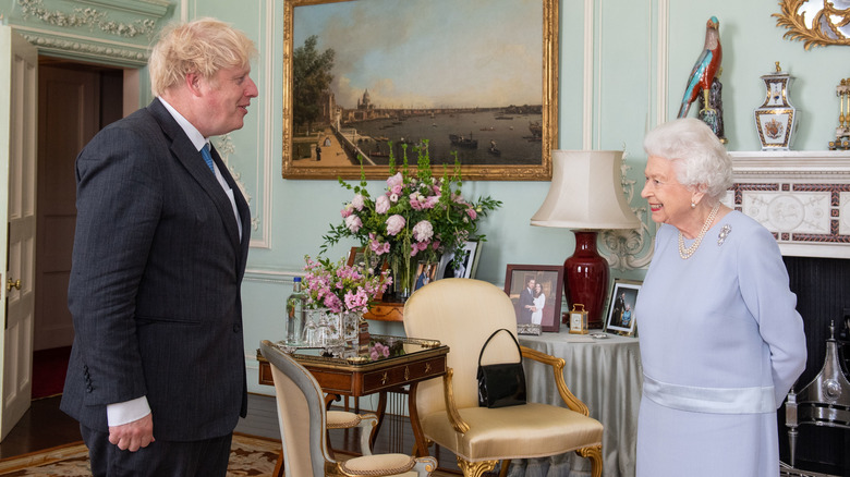 Boris Johnson talking to Queen Elizabeth