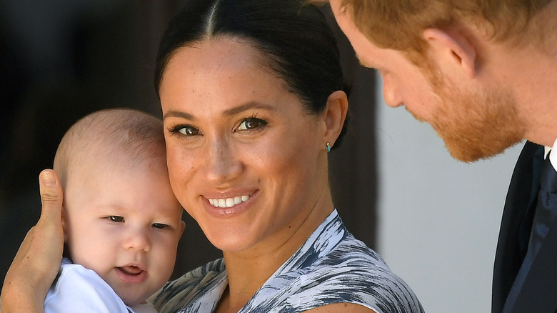 Archie with his parents in South Africa