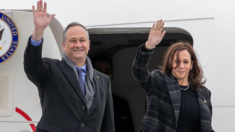 Doug Emhoff and Kamala Harris waving 