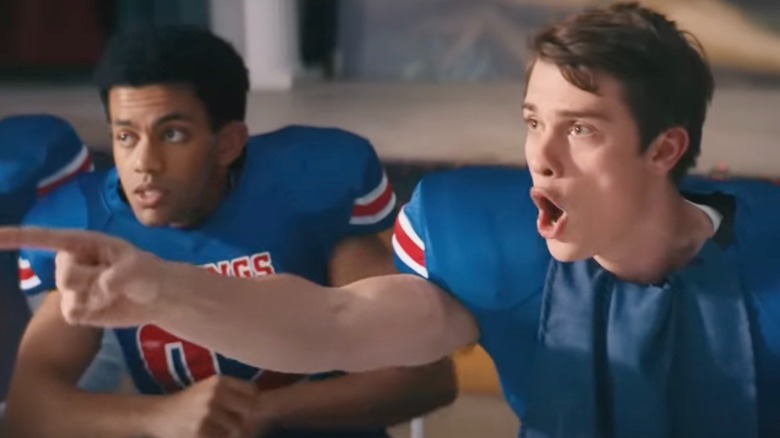 Nicholas Galitzine in football jersey pointing in Bottoms